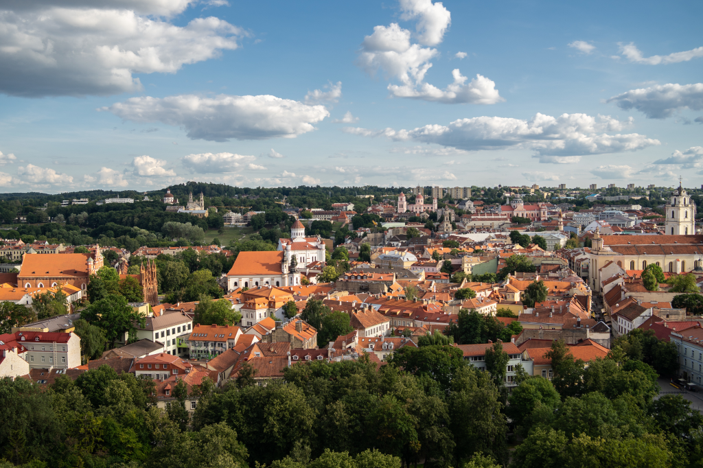 2dc3e-vilnius-city-surrounded-by-buildings-greenery-sunlight-cloudy-sky-lithuania