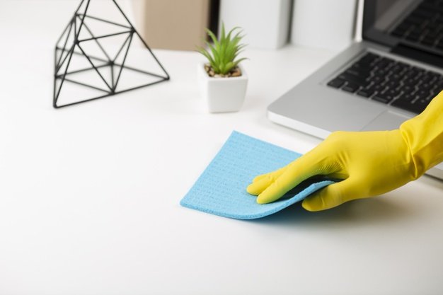 69535-hand-cleaning-office-desk_23-2148333870